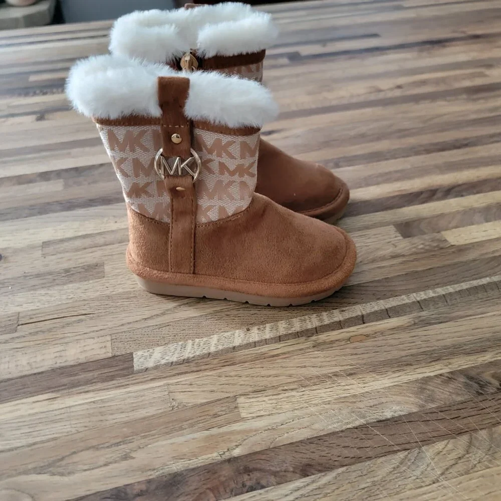 Michael Kors Yancy Girl Toddler boots featuring a brown logo print and faux fur